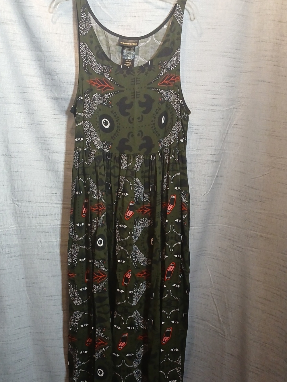 Nooworks Olive Green Graphic Maxi Dress with repeating eyes and open Mouth Sz S